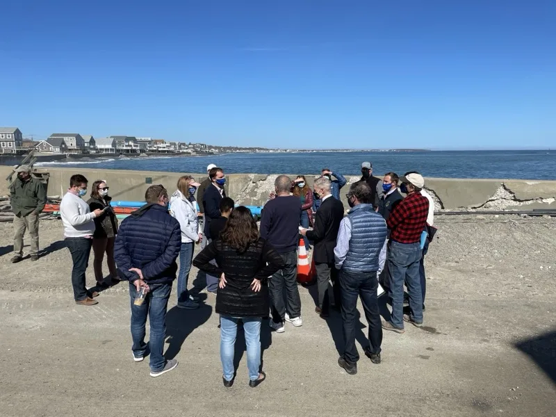 Officials and residents gathered on the seawall at Cedar Point, April 9 2021