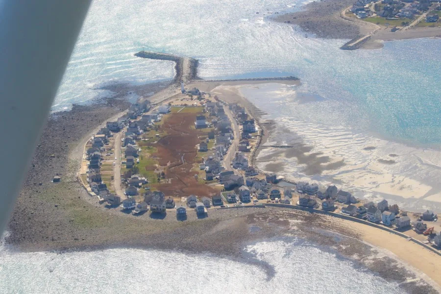 Aerial view of the Cedar Point neighborhood ringed by seawall on all sides