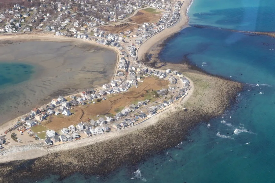 Aerial view along Lighthouse Road showing the seawall curving out to Cedar Point